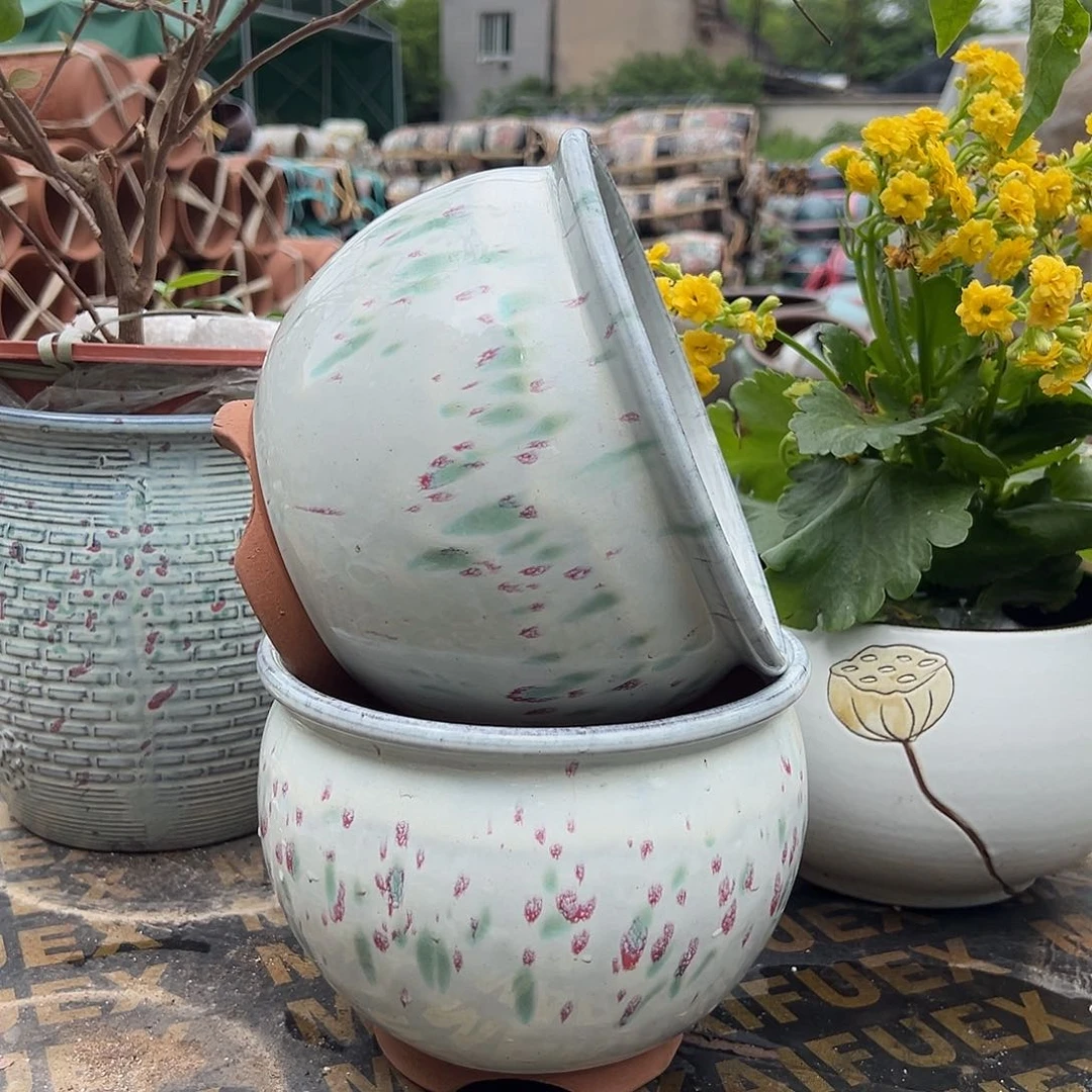 紫砂花盆口19高16两个底部有脚