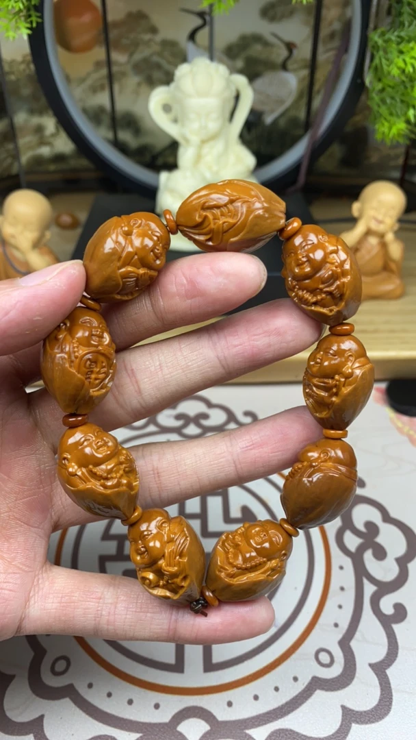 橄榄核雕工艺手串包衣弥勒强