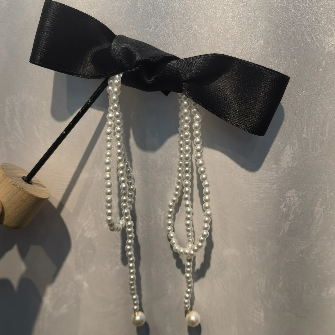 C292黑色蝴蝶结流苏弹簧夹