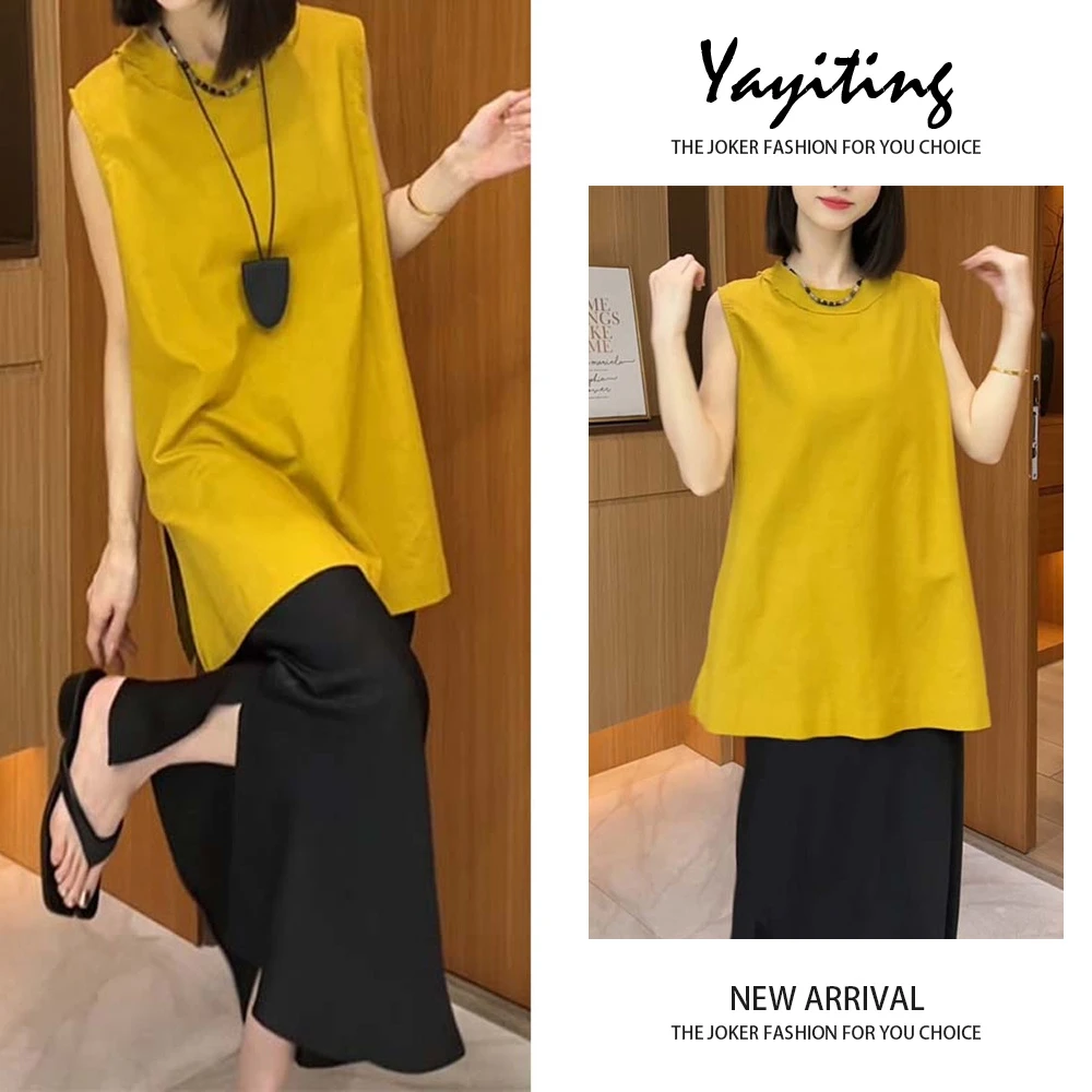 2025新款宽松中长款姜黄色T恤设计感后开叉上衣黑色半身裙套装女