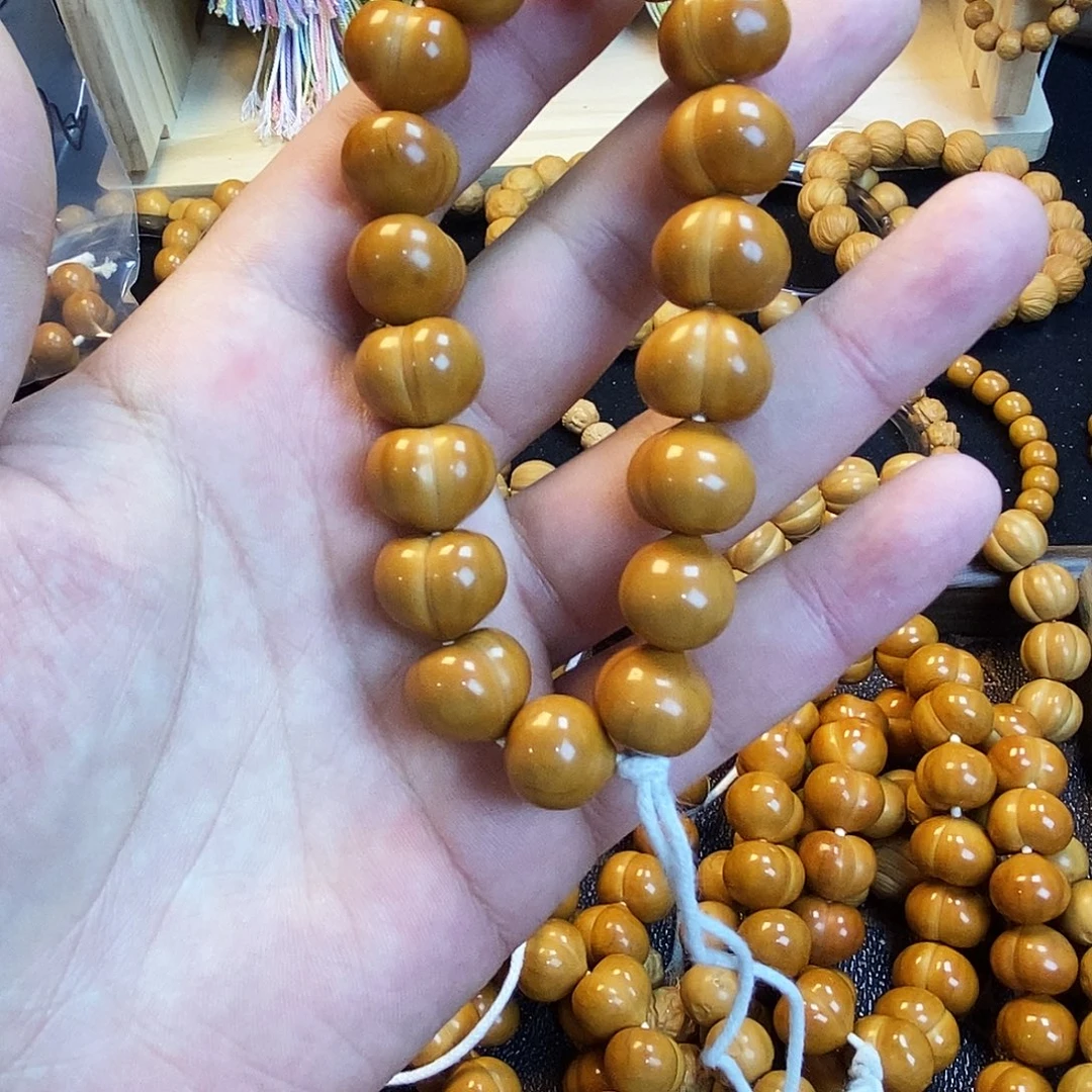 陈***木吊坠猴头核桃瑕疵柯基屁桃