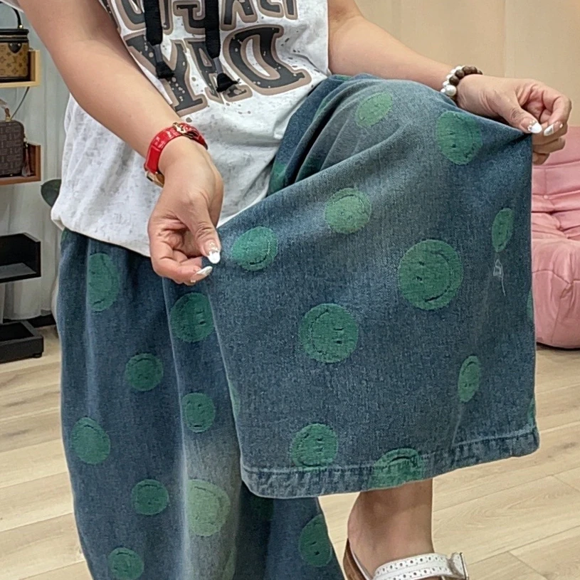 647绿色笑脸牛仔八分裤女