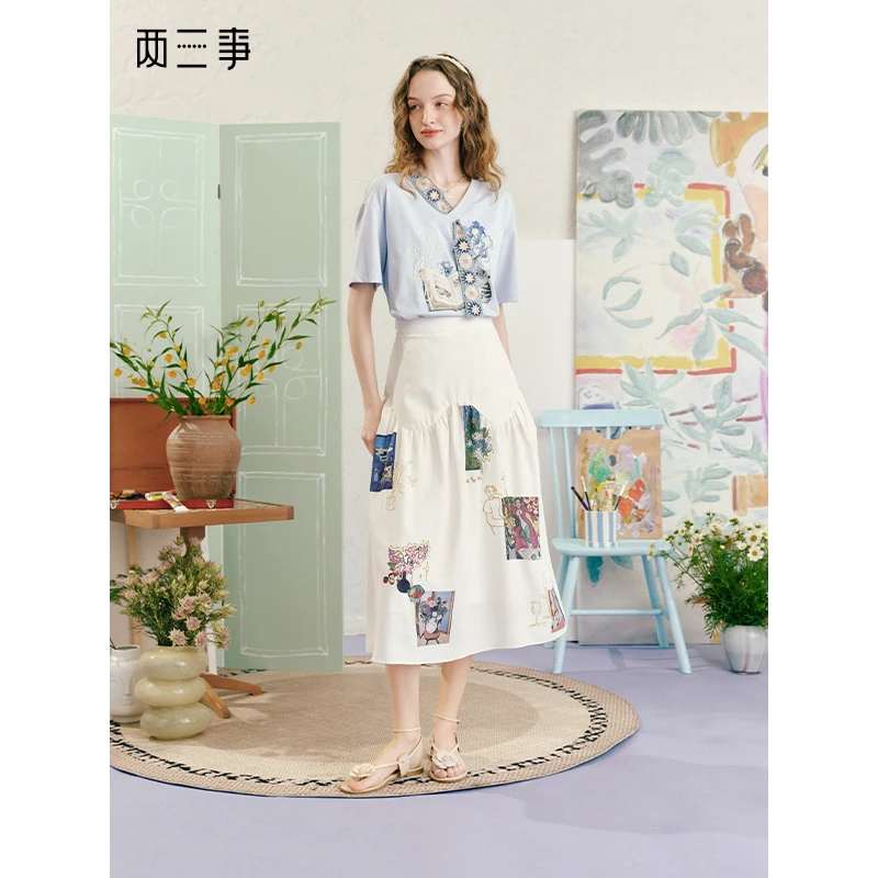 两三事玩彩旋涡2025夏季新款文艺风印花布拼接刺绣高腰a字半身裙