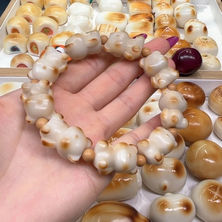 白玉菩提把件2.22.52象牙果炭烤小熊