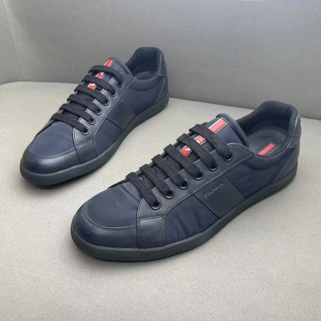 95新 Prada/普拉达 藏蓝色网面鞋舌红标logo时尚百搭板鞋 42码