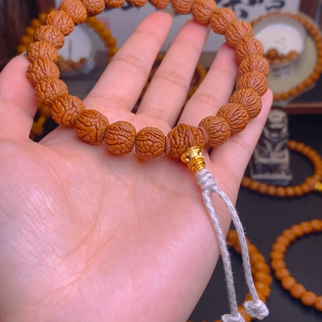 是***岩桃核手串龙泽女咯核