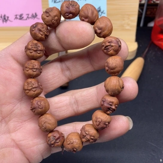 龙纹桃核开心手串色差