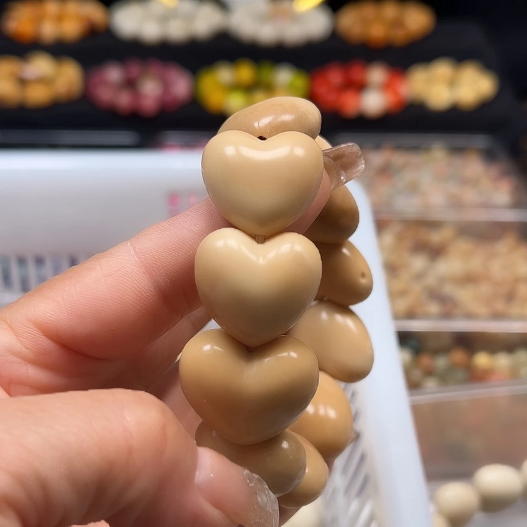 菩提根/象牙果手串瑕疵茶色爱心11颗有裂