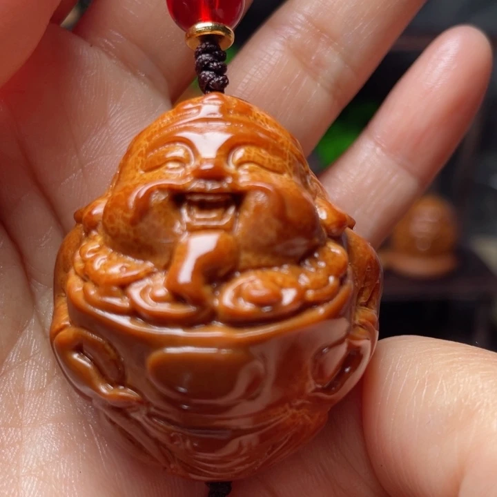 天然印尼大橄榄核雕刻指环穿配聚宝财神40左右100号（无礼盒）