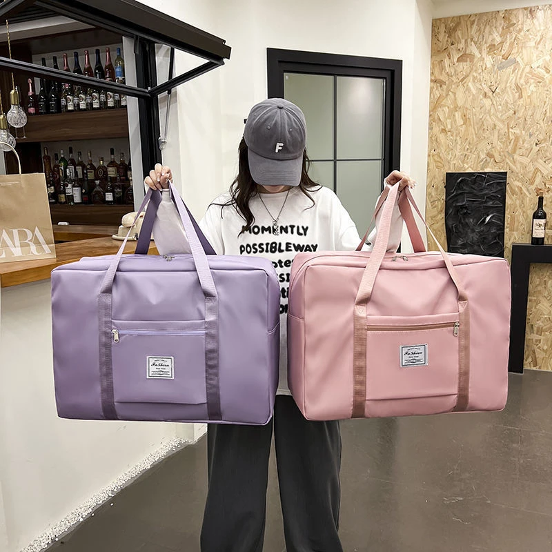 旅行收纳袋大容量手提行李包开学衣服被子斜纹牛津布大号旅行包