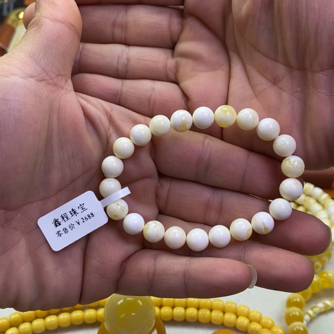 用***8琥珀未镶嵌裸石蜜蜡圆珠