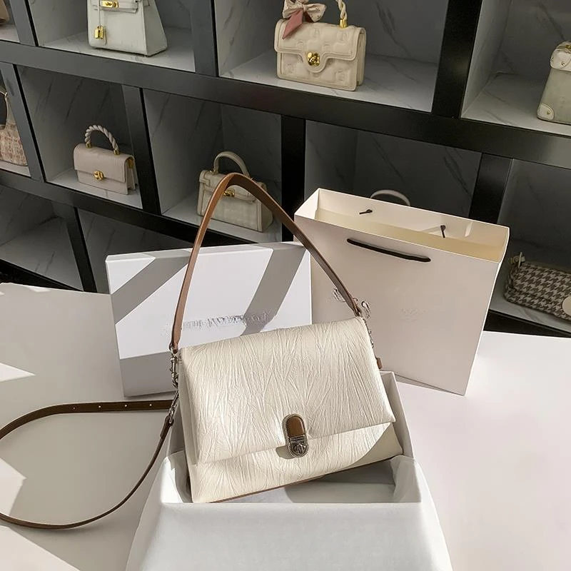 真皮米白色腋下包女夏2025新款高端大气高级感轻奢小众软皮托特包