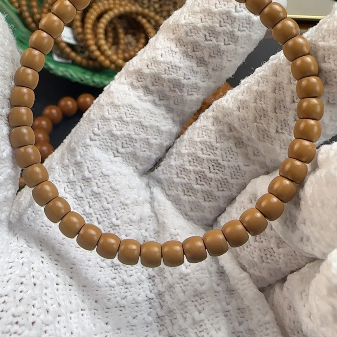 沉***言橄榄核手串老挝核尖单圈5.4mm极线弧