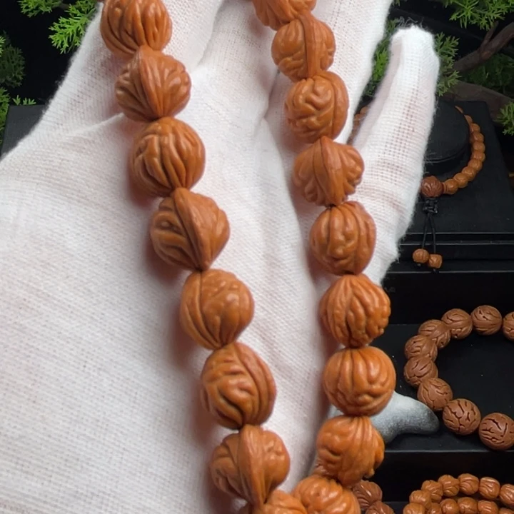 用***6桃核吊坠精品手持