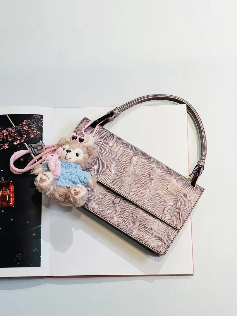 95新 Prada/普拉达 牙牙 复古纹理腋下手提包