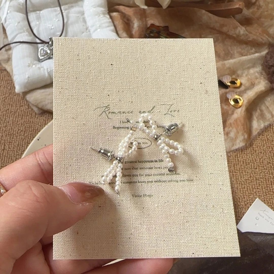 非洲檀香无事牌蝴蝶结耳钉