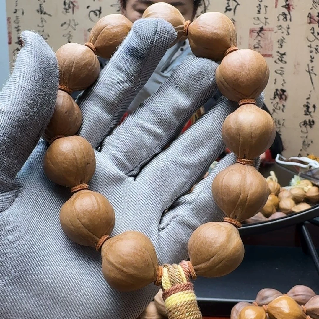 奔***灞手串橄榄核铁核圆