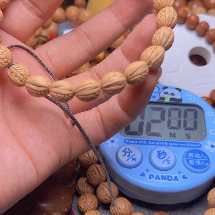 答**.拍野生桃核宽琪手持