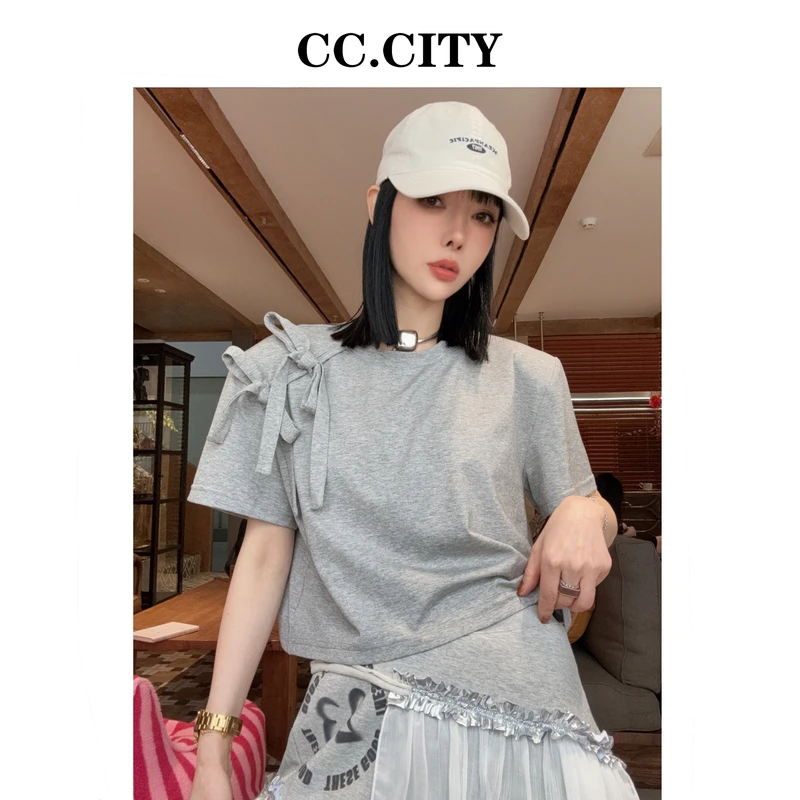 【蔡丽丽 & 添羽 】时尚洋气百搭个性蝴蝶结垫肩上衣6x915