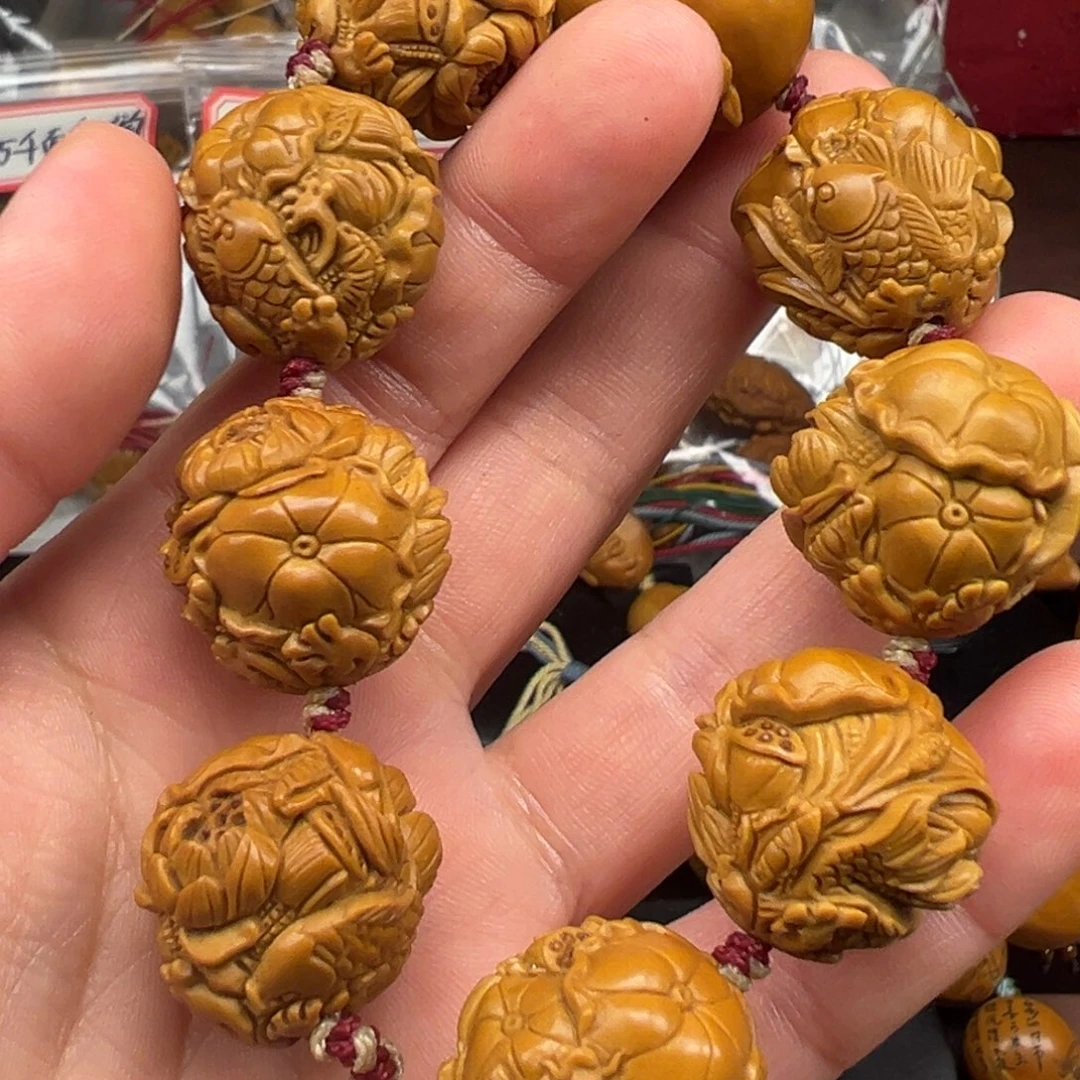 祚***玎手串/手链橄榄核荷花鱼