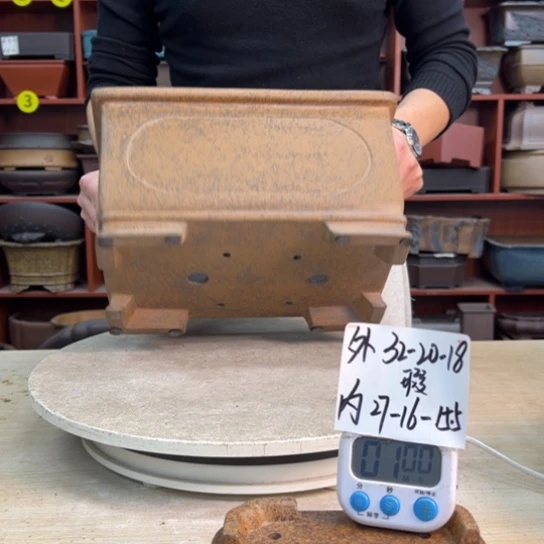 旅***忙紫砂花盆中香气浓