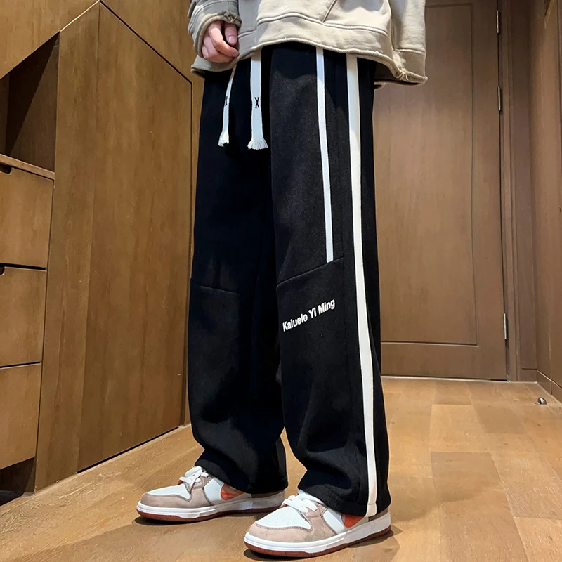 春季新款灯芯绒长裤宽松显瘦潮流百搭休闲裤垂感直筒裤抽绳
