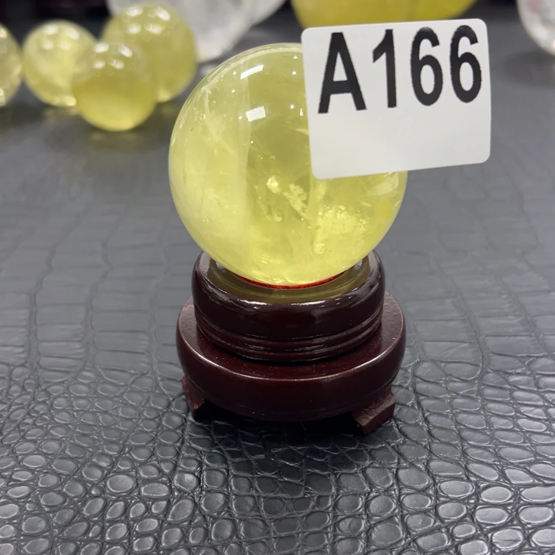 火***也石材天然黄水晶球5.68