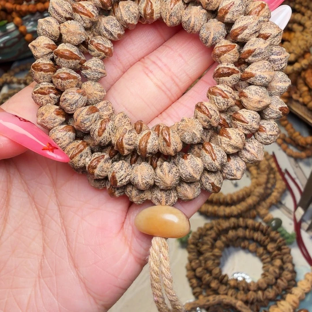 曾***.柏香籽/百香籽吊坠