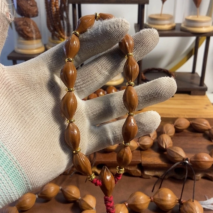 橄榄核吊坠11 x20梅林红皮老料油核