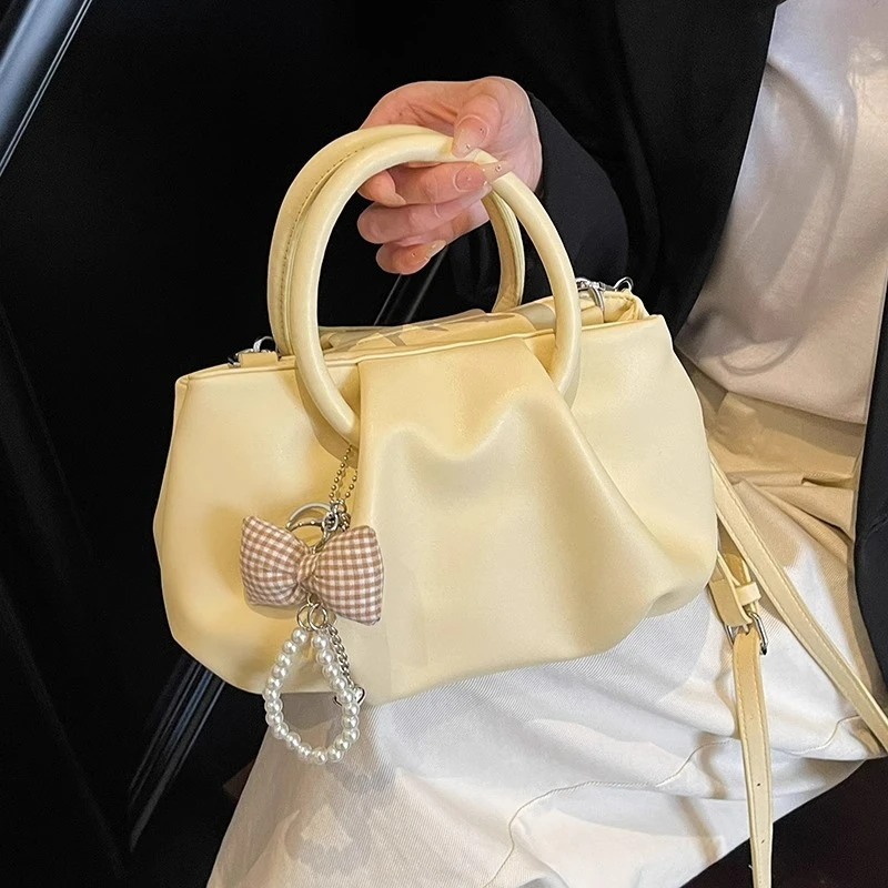 高级感洋气褶皱手提枕头包包女式2025新款春夏时尚外出上班斜挎包