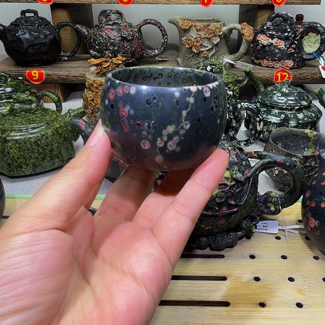 捷****建石材梅花玉安山玉杯