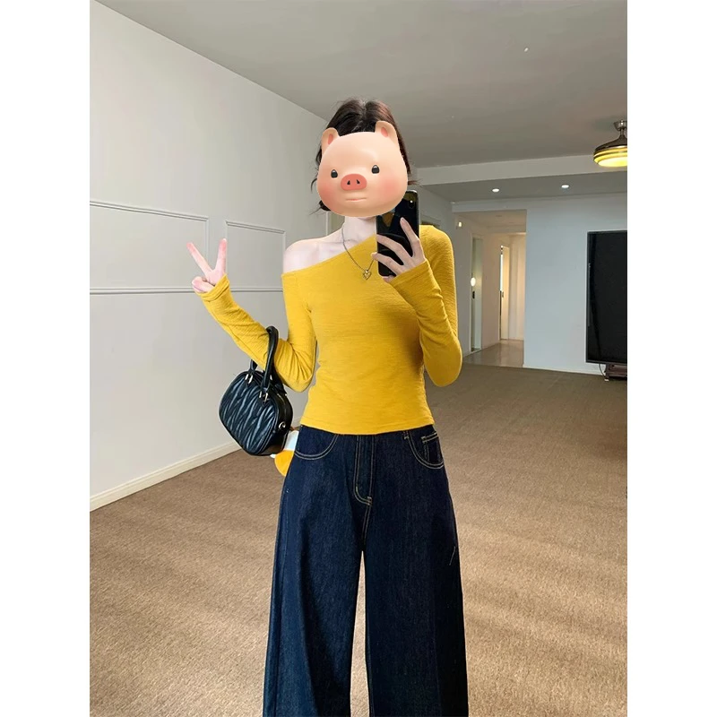 黄色不规则斜肩长袖T恤女2025早春季新款修身露肩内搭打底衫上衣