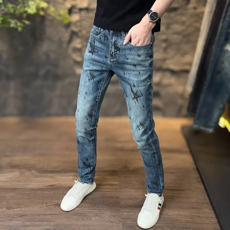 秋季流星雨印花水洗蓝色男款牛仔裤痞帅潮男裤子修身弹力小脚长裤