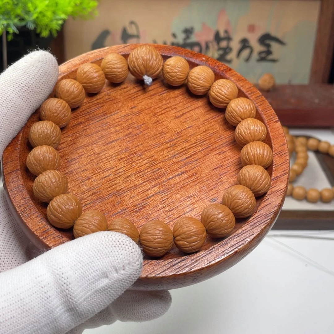 尽****猴头核桃手串凤羽