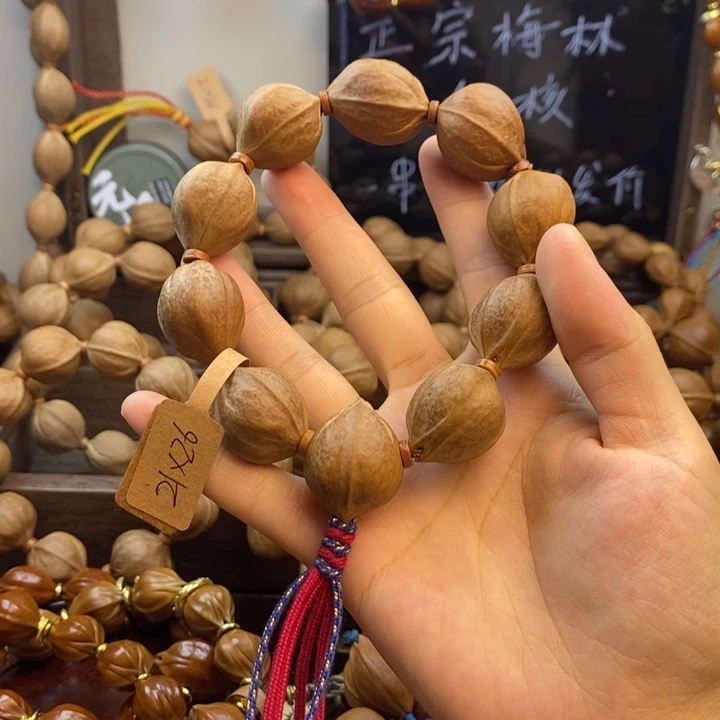 逆***鳞橄榄核手串21.26有三通
