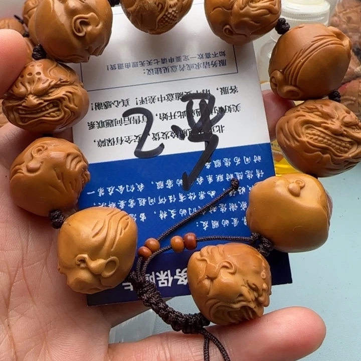 橄榄核手串躺***子雕刻工艺