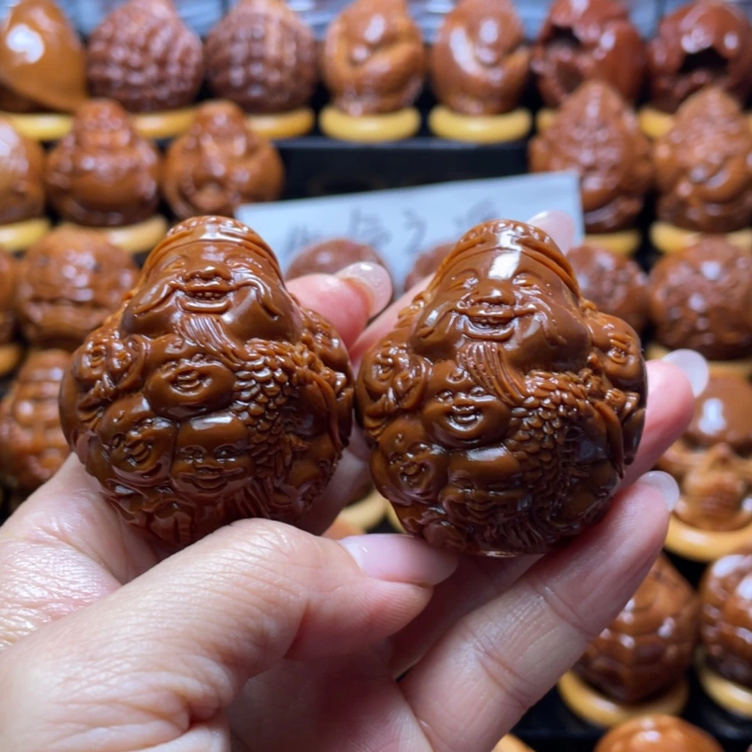 鸿***头橄榄核把件橄榄核雕