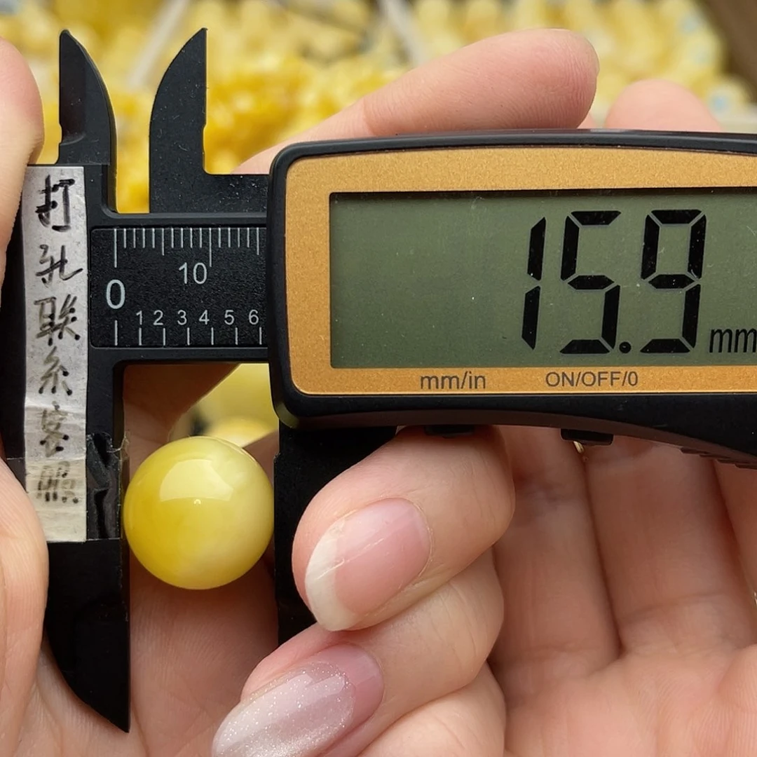 裸石琥珀未镶嵌什****.蜜蜡圆珠鸽