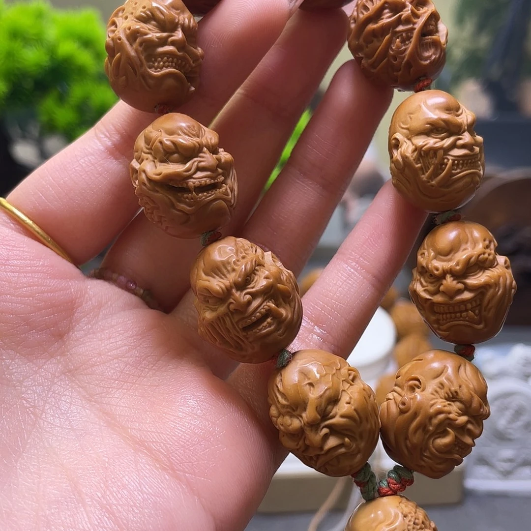 朗***少橄榄核吊坠橄榄核雕