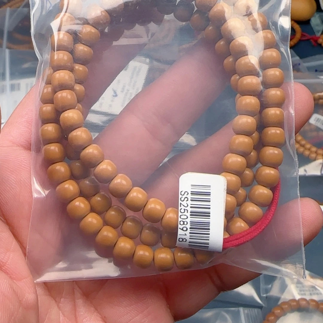 Z***_橄榄核手串老挝SS级核尖极限弧尺寸6.4全无白