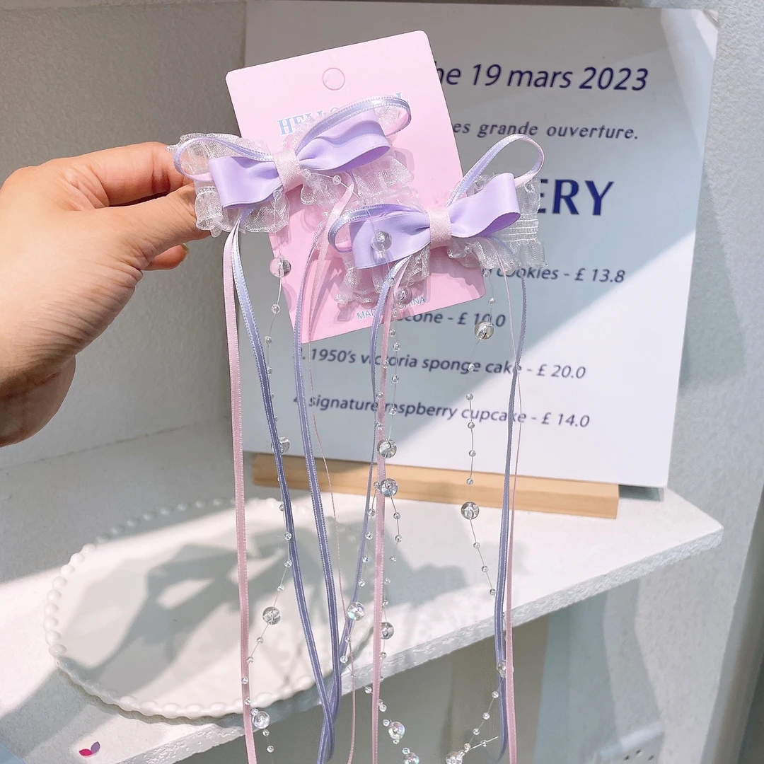 A-7702  2个紫色蝴蝶结珠珠飘带公主古风甜美鸭嘴夹        发圈