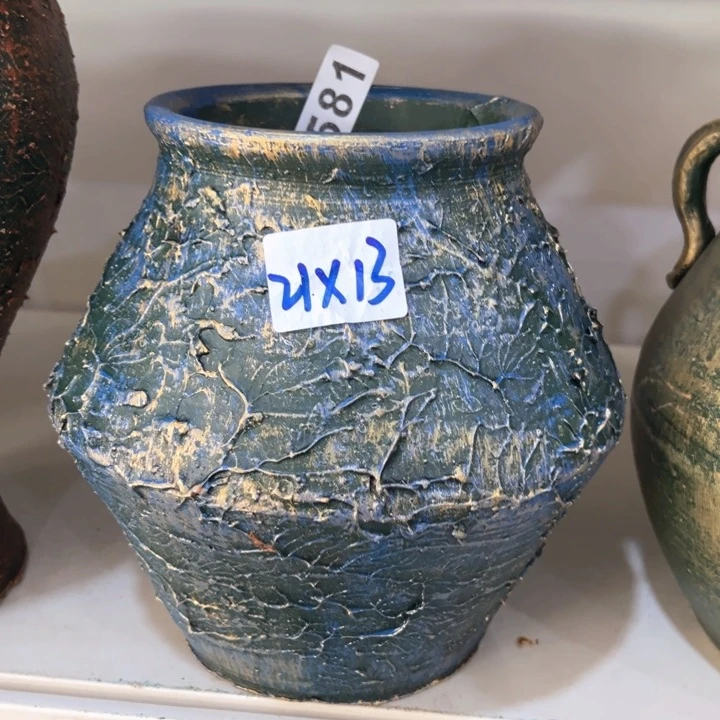 16.8-1微瑕土陶飞碟兰金