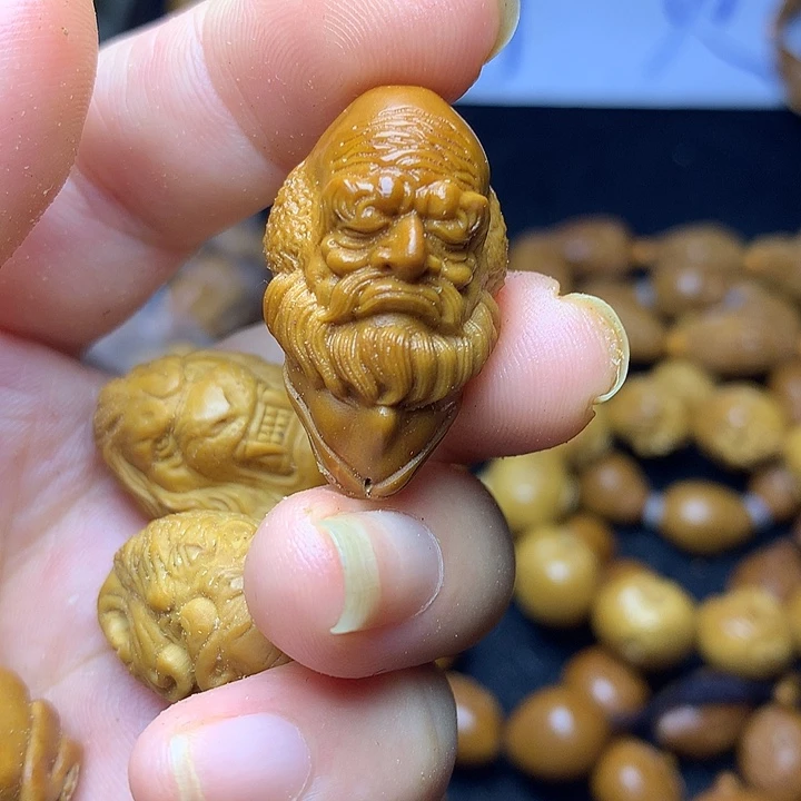 橄榄核雕刻单籽罗汉