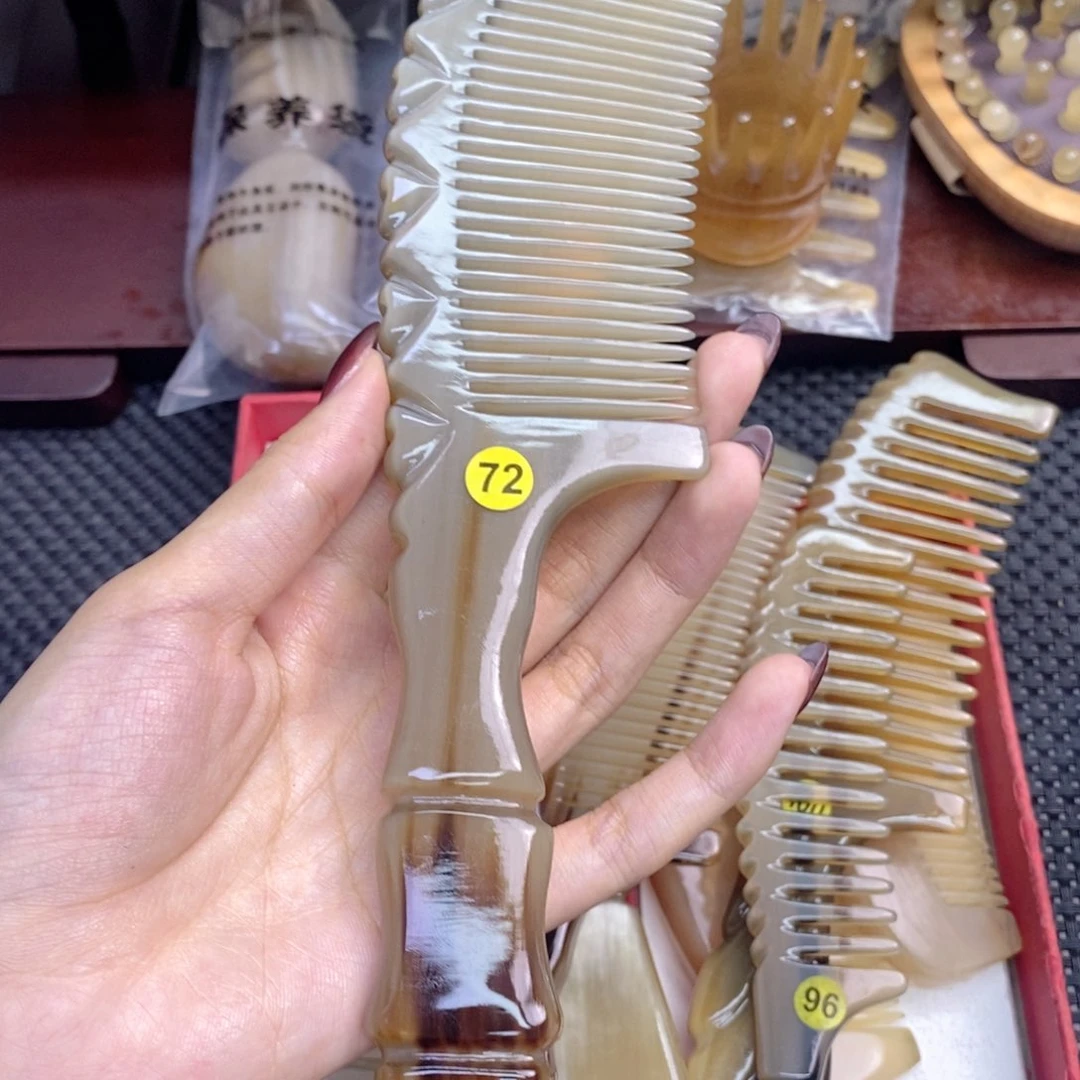 纯手工制作纯牛角梳子蜕**?