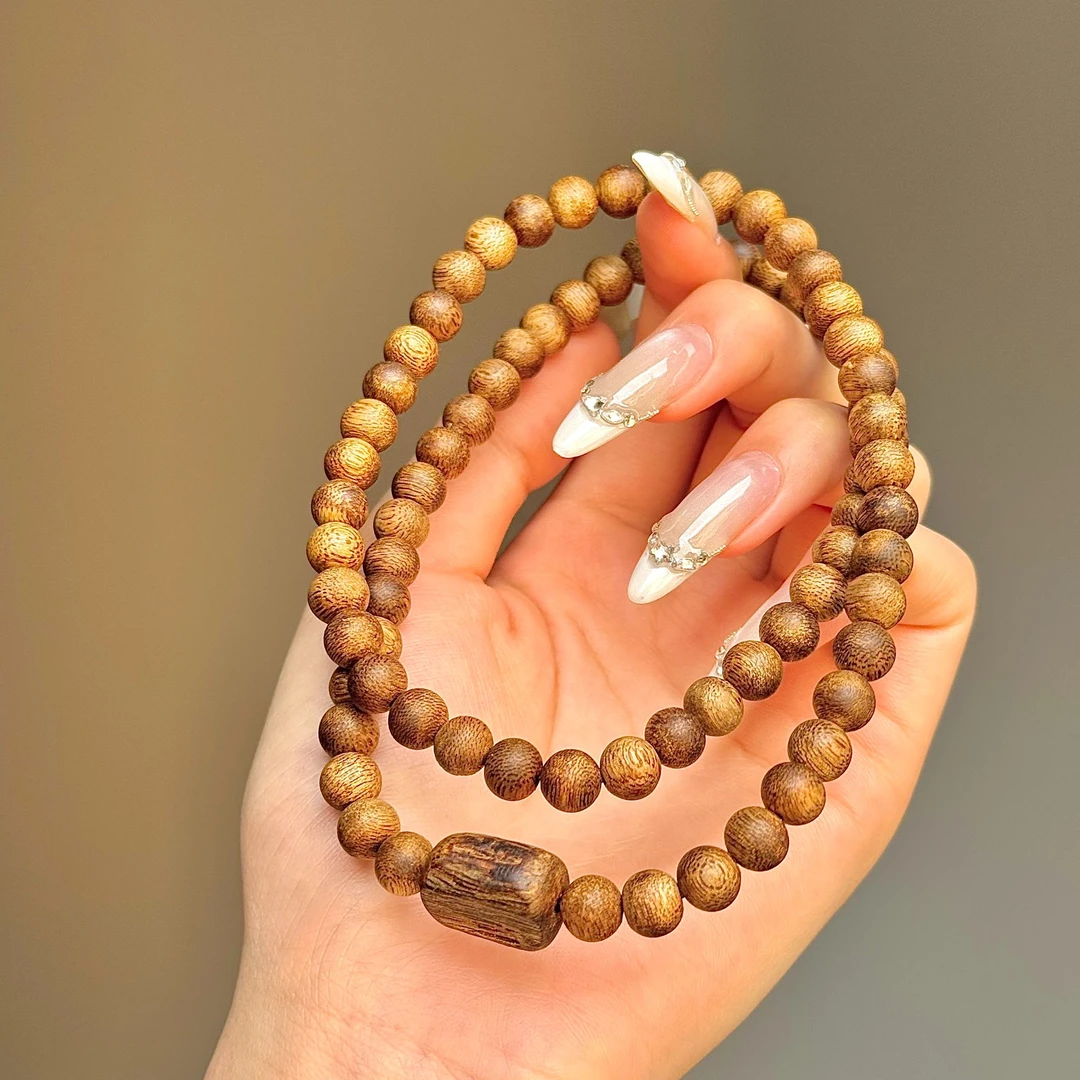 沉香【明智师兄】7mm莺歌绿棋楠圆珠叁圈老料手串（树心油形状随机）