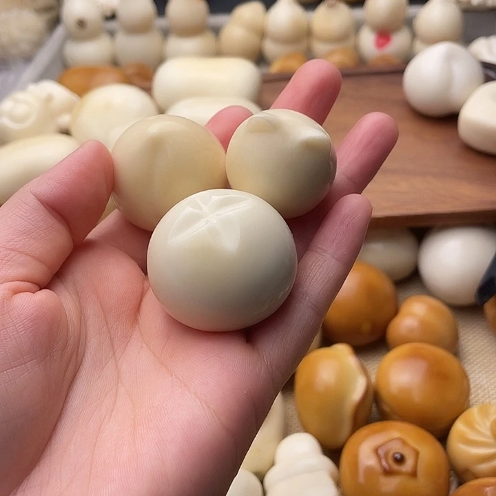 萱***萱把件菩提根/象牙果桃子猫头十字包