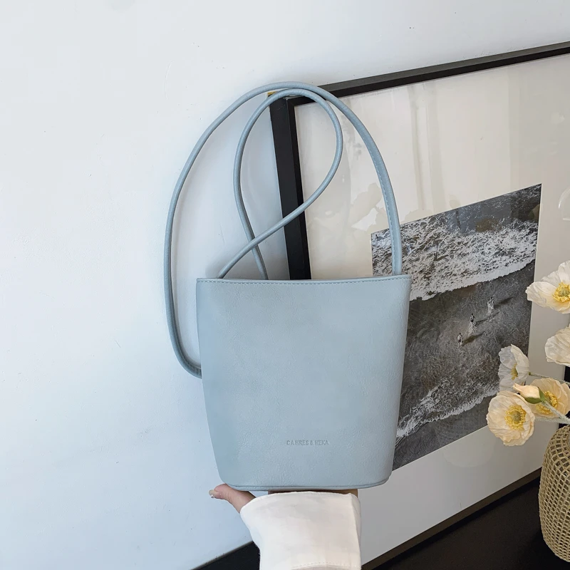 夏天小清新时尚手提白色包包2025新款简约水桶包小众高级感腋下包