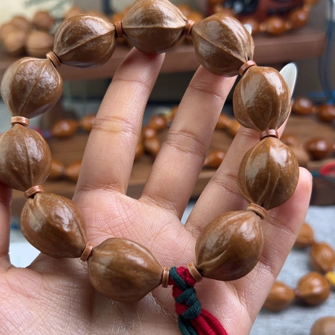 麒***ა手串橄榄核20/25   三花梅林铁核