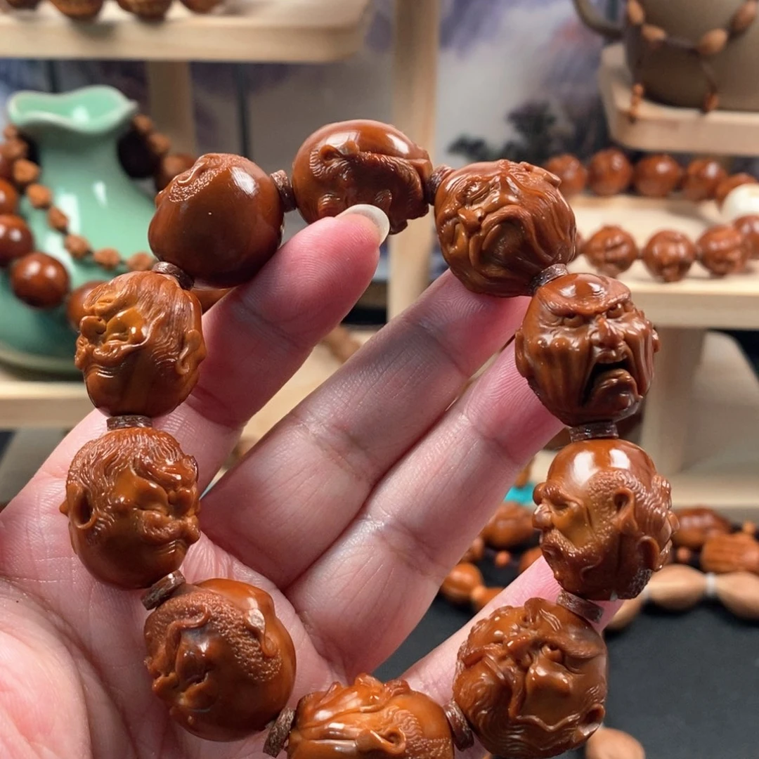 皮***塔手串橄榄核微包浆写实十八罗汉手串
