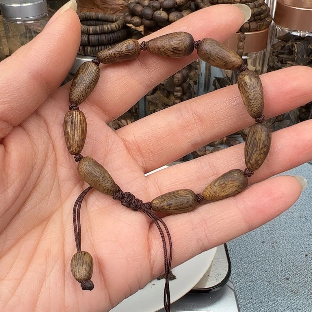 沉香木手把件奇楠乌身水滴形手串5克